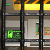 Thumbnail detail of ATM machine with heavy iron bars in front of it.