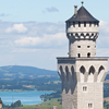 Cropped detail from photo of Neuschwanstein Castle, in Bavaria, Germany, which looks similar to Cinderella's castle in Disney World, used to illustrate both an e-book and an article by Richard Klass with titles such as