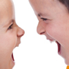 Close-up of two kids yelling at each other, illustrating article by Richard Klass about a dispute between siblings over real estate profits and limited partnerships.