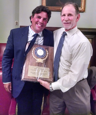 Richard A. Klass (l) presents award to Lew Tesser for service to the New York State Bar Association.