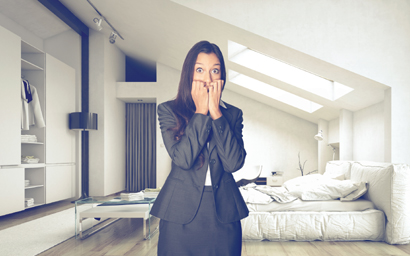 Frightened woman in fashionable, white apartment. copyright: PlusONE/Shutterstock.com