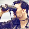 Man looking through binoculars, illustrating an article about attorney illness by Richard Klass