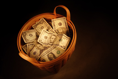 basket of money illustrating book about Surplus Moneys Proceedings in Foreclosure Actions under RPAPL Section 1361 by Richard Klass