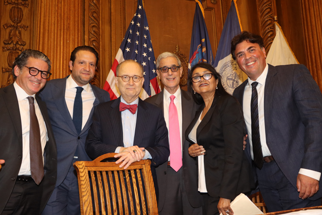 Brooklyn Legal Professionals standing for a photo with Richard A. Klass.